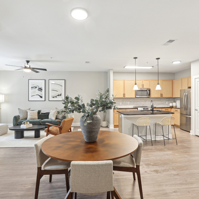 Porter Westside - Apartments in Atlanta, GA - A spacious and tidy living room and kitchen area featuring modern furnishings
